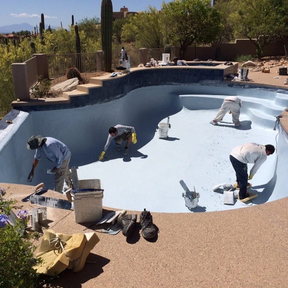 Team of construction workers building a custom pool in Tucson