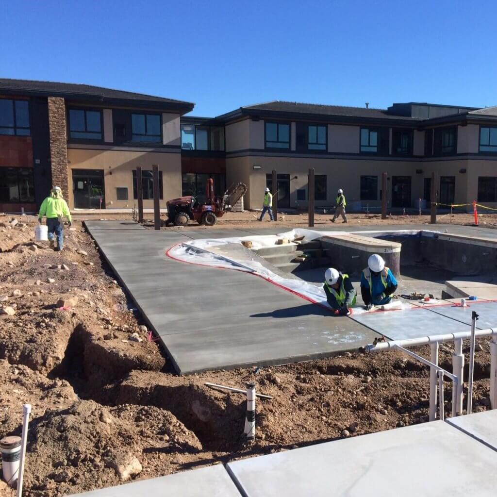 Cimarron Circle Construction team building a large inground pool
